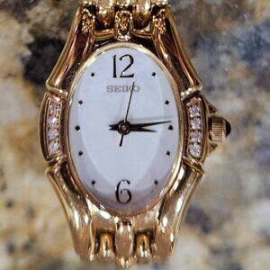 Seiko Women's SXGM28 Oval Goldplated Watch with 8 Diamonds & Black Sphere Stem